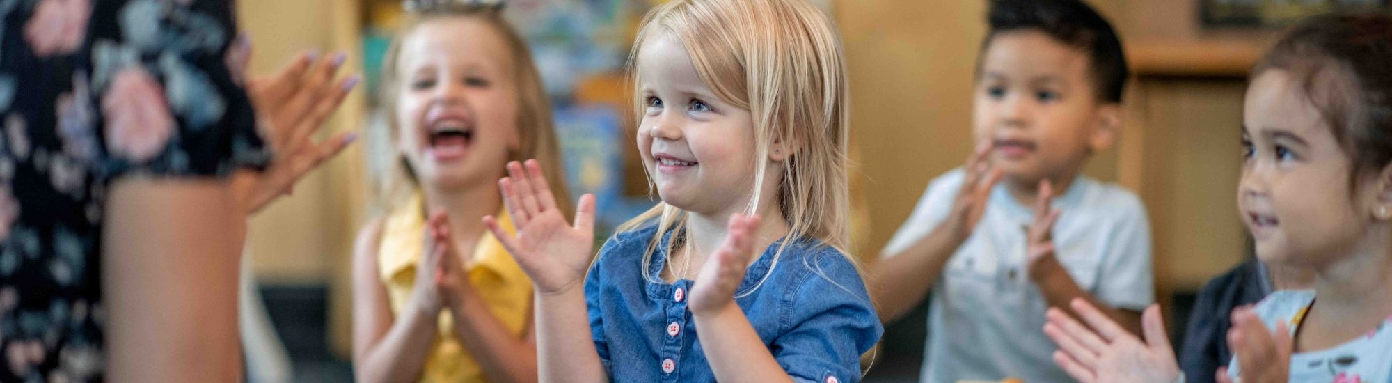 Young children clapping